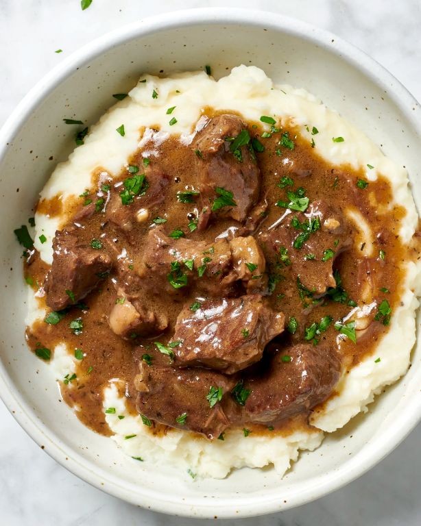 Beef Tips and Gravy over Mashed Potatoes